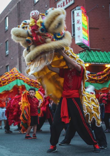 picture of people doing lion dance on the street