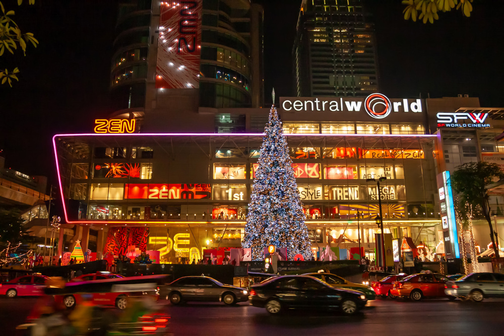 Bangkok, Thailand - December 10, 2007: CentralWorld shopping plaza and complex and Christmas tree at night from Ratchadamri Rd street in city downtown
