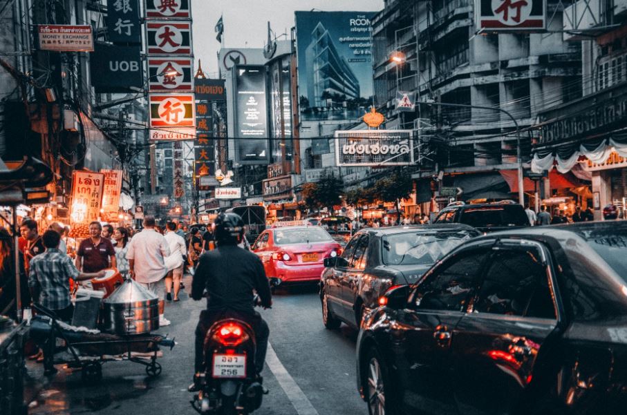 crowded streets with cars passing by