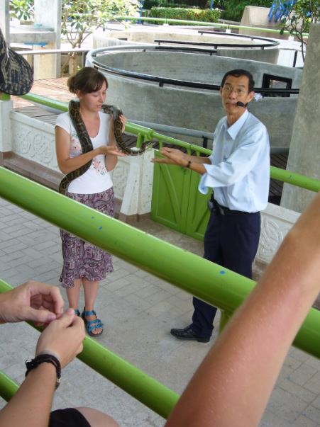 woman holding a snake