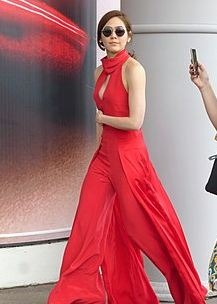 Araya A. Hagate in a red gown and sunglasses